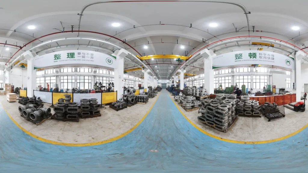 Panoramic view of BSO Ballseal industrial valve manufacturing workshop, featuring a well-organized production floor with arranged valve castings and 5S management standards
